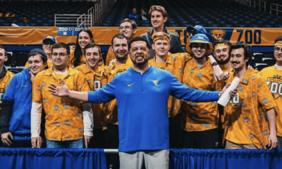 Pitt head coach Jeff Capel with members of the "Oakland Zoo," Pitt's student section.